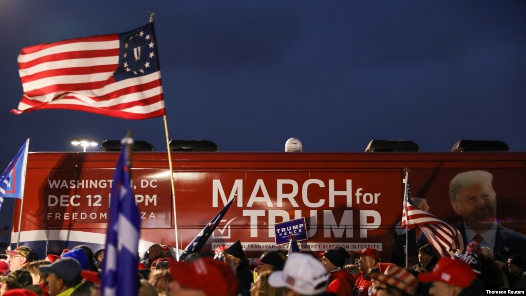 People take part in an event to show their support for U.S. President Donald Trump in Macomb County, Michigan, December 8, 2020.