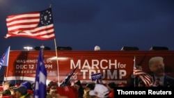 People take part in an event to show their support for U.S. President Donald Trump in Macomb County, Michigan, December 8, 2020.