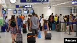 Passengers walk in Nice Cote D'Azur International Airport in Nice, France, one of the host cities for the Euro 16 football championship, June 10, 2016.