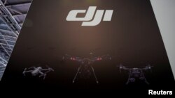 A DJI logo is seen at a security exhibition in Shanghai, China May 24, 2019. 