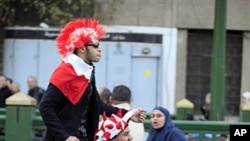 Egyptians celebrate on Tahrir Square in Cairo, February 12, 2011