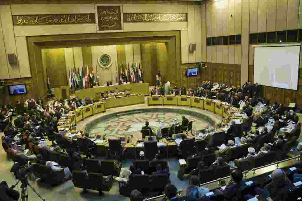 Arab foreign ministers take their seats for their meeting at the Arab League headquarters in Cairo, Egypt, Sept. 7, 2014.