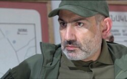 In this grabtaken from a video released by the Armenian Prime Minister Press Service, Oct. 6, 2020, Prime Minister Nikol Pashinyan attends a meeting with army commanders in the self-proclaimed Republic of Nagorno-Karabakh, Azerbaijan.