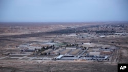 FILE - Al-Asad air base is seen in the western Anbar desert, Iraq, Dec. 29, 2019. 