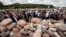 FILE - Jews gather to mark the 75th anniversary of a massacre of Jews in Jedwabne, Poland, July 10, 2016. In March 2019, Polish Jews are objecting to the possible exhumation of remains at the site, saying it would violate Judaism's general prohibition of disinterment.