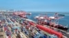 Shipping containers and gantry cranes are seen at a port in Lianyungang, in eastern China's Jiangsu province on Aug. 7, 2024.