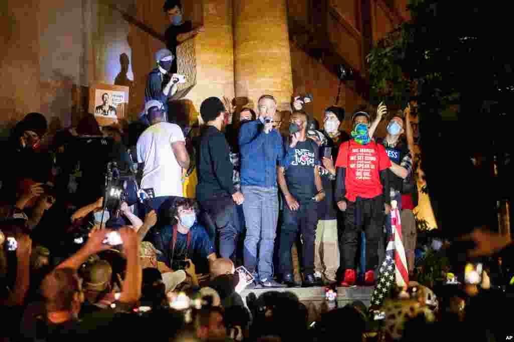 Portland Mayor Ted Wheeler speaks to Black Lives Matter protesters, July 22, 2020, in Portland, Oregon. Wheeler was hit with chemical irritants several times by federal officers dispersing demonstrators.