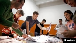 Election Commission officials count votes in the central Bosnian town of Zenica Oct. 12, 2014.