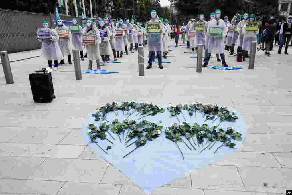 Nurses belonging to the NurSind union stage a protest in front of the Pirelli skyscraper, which hosts the group&#39;s Lombardy Region headquarters, in Milan, Italy.