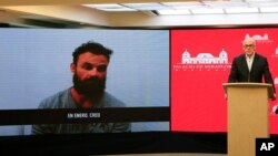 Jorge Rodriguez shows a video of Airon Berry, a former U.S. special forces soldier associated with the Florida-based private security firm Silvercorp USA, during a televised statement in Caracas, May 7, 2020. (By Venezuela's Ministry of Communication)