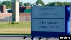 Signage is seen at a federal correctional complex as Daniel Lewis Lee, convicted in the killing of three members of an Arkansas family in 1996, is set to be put to death in the first federal execution in 17 years, in Terre Haute, Indiana, July 13, 2020.