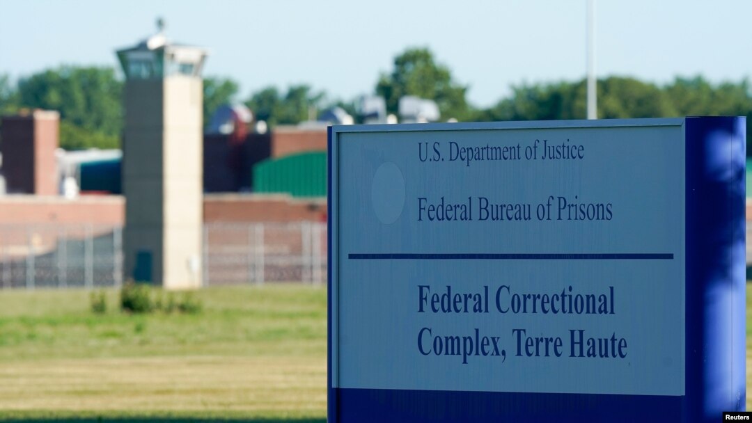 Signage is seen at a federal correctional complex as Daniel Lewis Lee, convicted in the killing of three members of an Arkansas family in 1996, is set to be put to death in the first federal execution in 17 years, in Terre Haute, Indiana, July 13, 2020.