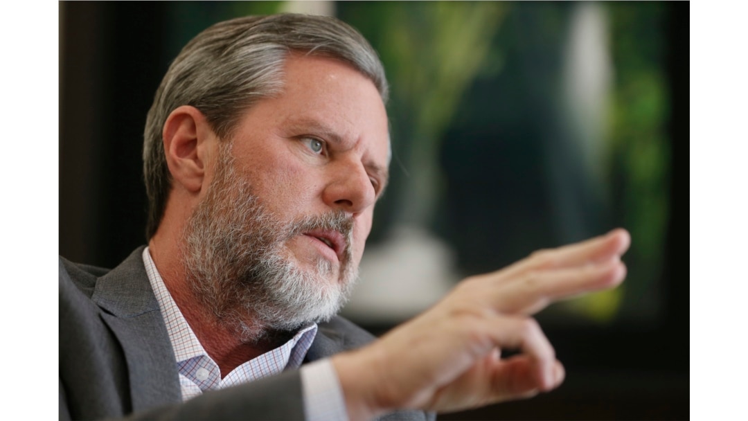 FILE - Liberty University President Jerry Falwell Jr. gestures during an interview in his offices at the school in Lynchburg, Va., Nov. 16, 2016.