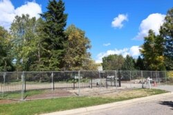 A chain-link fence surrounds the Michigan governor's mansion on Oct. 8, 2020 in Lansing, Michigan.