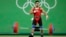 L'égyptien Mohamed Ihab Youssef en finale de l'épreuve d'haltérophilie des 77kg aux Jeux Olympiques de Rio le 10 août 2016.