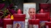 Raindrops are are seen on candles adorned with an image of Pope Francis outside the Agostino Gemelli Polyclinic where the pontiff is hospitalized in Rome, Feb. 24, 2025.