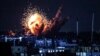 A ball of fire and smoke rise above buildings during an Israeli strike on Rafah in the southern Gaza Strip, on October 15, 2023.