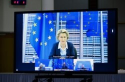 European Commission President Ursula von der Leyen, top, European Central Bank President Christine Lagarde, European Council President Charles Michel and Eurogroup President Paschal Donohoe attend a virtual meeting in Brussels, Nov. 26, 2020.