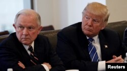 FILE - Donald Trump sits with U.S. Senator Jeff Sessions at Trump Tower in Manhattan, New York, Oct. 7, 2016. 