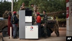 A man loads ballot boxes and other election material onto a donkey&nbsp;to be transported to polling stations not accessible by road, in Shutul, Panjshir province, June 13, 2014.&nbsp;