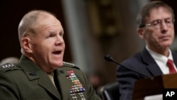 Marine Gen. Robert B. Neller, left, commandant of the Marine Corps, and Acting Navy Secretary Sean J. Stackley appear before the Senate Armed Services Committee on the investigation of nude photographs of female Marines and other women that were shared on the Facebook page "Marines United," on Capitol Hill in Washington, March, 14, 2017.