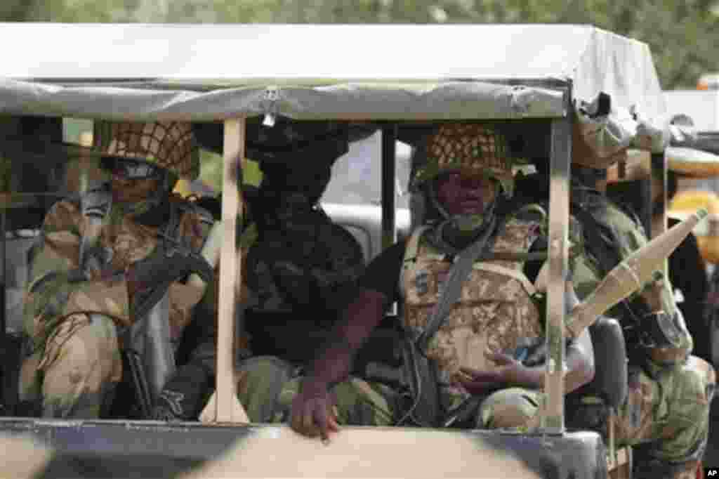 Nigerian soldiers wait to go on guard in Marte, Nigeria.