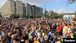 Activists attend a rally to demand authorities allow opposition candidates to run in an upcoming local election, and release protesters detained during recent demonstrations, in Moscow, Russia, Aug. 31, 2019.
