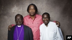 From left, Bishop Christopher Senyonjo, filmmaker Roger Ross Williams and Rev. Kapya Kaoma from the film "God Loves Uganda" pose for a portrait during the 2013 Sundance Film Festival on January 20, 2013 in Park City, Utah.