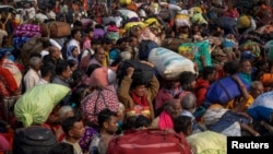 Devotees wait to enter a railway station as they leave after attending the "Maha Kumbh Mela"— also known as the Great Pitcher Festival — a day after a deadly stampede, in Prayagraj, India, Jan. 30, 2025.