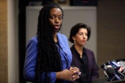 Rhode Island Director of Health Nicole Alexander-Scott, left, and R.I. Gov. Gina Raimondo, right, face reporters during a news conference, March 1, 2020, in Providence, R.I.