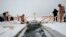 A man takes a dip in icy waters during Orthodox Epiphany celebrations on the Sea of Japan in Vladivostok, Russia, Jan.19, 2016. Orthodox believers mark Epiphany on January 19 by immersing themselves in icy waters regardless of the weather. 