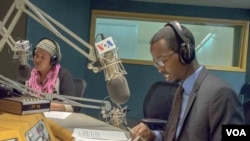 VOA Somali’s Falastin A. Iman and Ismail H. Mohamed on air during the program's first broadcast on November 30