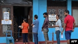 People queue at a polling station before casting their ballots to vote in Sri Lanka's parliamentary election in Colombo on Nov.r 14, 2024.