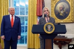 U.S. Attorney General Pam Bondi speaks after being sworn in by Supreme Court Associate Justice Clarence Thomas, in the Oval Office of the White House, Feb. 5, 2025, in Washington, as President Donald Trump looks on.