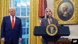 Attorney General Pam Bondi speaks after being sworn in by Supreme Court Associate Justice Clarence Thomas, in the Oval Office of the White House, Feb. 5, 2025, in Washington, as President Donald Trump looks on.