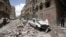 People inspect the site of an airstrike by Saudi-led coalition in Sanaa, Yemen, May, 16, 2019. 