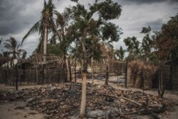 FILE - The remains of a burned and destroyed home is seen in the recently attacked village of Aldeia da Paz outside Macomia, in the Cabo Delgado Province in northern Mozambique, Aug. 24, 2019.