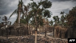 FILE - The remains of a burned and destroyed home is seen in the recently attacked village of Aldeia da Paz outside Macomia, in the Cabo Delgado Province in northern Mozambique, Aug. 24, 2019.