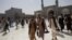 Pria Afghanistan berjalan di sebuah masjid di Herat, Afghanistan, 10 September 2021. (Foto: WANA/West Asia News Agency via REUTERS)