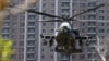 FILE - An AH-64E Apache attack helicopter lands during military drills in Hsinchu, Taiwan, on Oct. 29, 2020. Poland signed a $10 billion deal on Aug. 13, 2024, to purchase 96 of the aircraft.