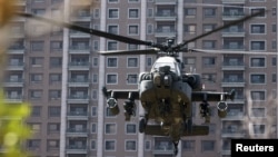 FILE - An AH-64E Apache attack helicopter lands during military drills in Hsinchu, Taiwan, on Oct. 29, 2020. Poland signed a $10 billion deal on Aug. 13, 2024, to purchase 96 of the aircraft.