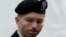 U.S. Army Private First Class Bradley Manning enters the courtroom for day four of his court martial at Fort Meade, Maryland, June 10, 2013. 