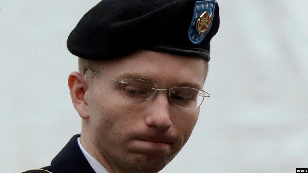 FILE - U.S. Army Private First Class Bradley Manning enters the courtroom for day four of his court martial at Fort Meade, Maryland, June 10, 2013. 