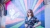 In this photo provided by the ACLU of Virginia, Ellenor Zinski stands for a portrait in front of a “You Matter” mural near the entrance to Blackwater Creek Trail, one of her favorite hiking trails in Lynchburg, Va., on Oct. 5, 2024.