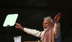 FILE - Indian Prime Minister Narendra Modi addresses a rally of his Hindu nationalist Bharatiya Janata Party in New Delhi, Dec. 22, 2019.