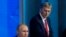FILE - Kremlin spokesman Dmitry Peskov listens as Russian President Vladimir Putin speaks during annual news conference in Moscow, Russia, Dec. 20, 2018. 