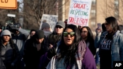 Carolina A. Castoreno-Santana, Executive Director of the American Indian Center of Indiana, speaks during a gathering in support of Native Americans in front of the Catholic Diocese in Covington, Ky., Tuesday, Jan 22, 2019.