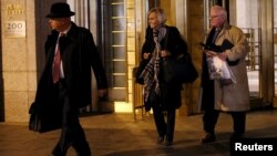 Attorneys Rebekah J. Poston (C) and John J. Reilly (R) leave U.S. District Court in the Manhattan borough of New York City, Nov. 12, 2015. Poston and Reilly are representing Efrain Antonio Campo Flores, 29, one of two of Venezuelan President Nicolas Maduro's relatives who have been indicted in the United States for cocaine smuggling.