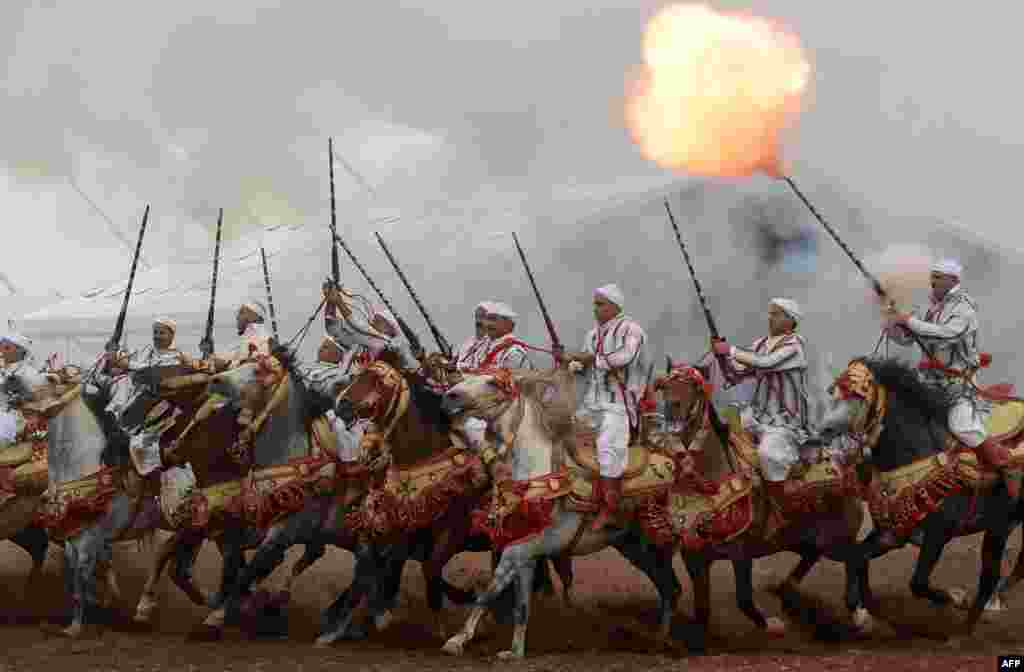 Moroccan horsemen perform during the 7th edition of the &quot;Salon du Cheval&quot; in the port city of El Jadida. 