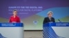 Executive Vice President of the European Commission for A Europe Fit for the Digital Age Margrethe Vestager, left, and European Commissioner for Internal Market Thierry Breton attend an EC press conference in Brussels, Dec. 15, 2020. 